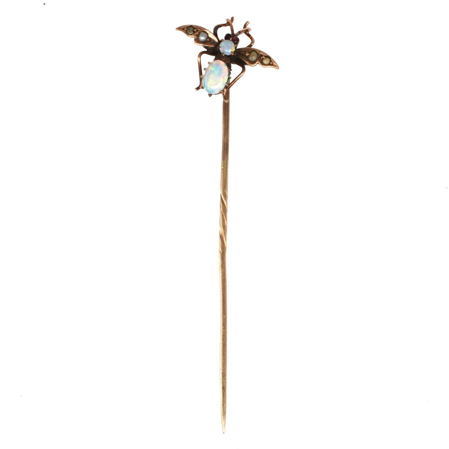 Edwardian 9ct gold bee tie pin featuring opal, seed pearl, and garnet details, perfect for lapel or tie.