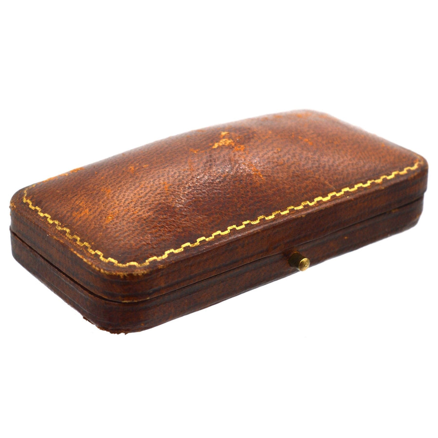 Antique leather box for Edwardian 9ct gold cufflinks and dress set, featuring classic gold detailing.