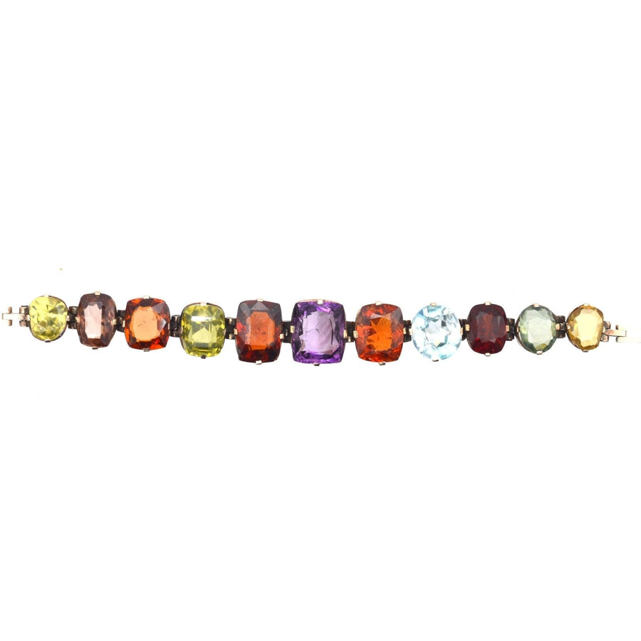 Edwardian 9ct gold harlequin multi-gem bracelet featuring citrine, garnet, aquamarine, and more colorful gemstones.