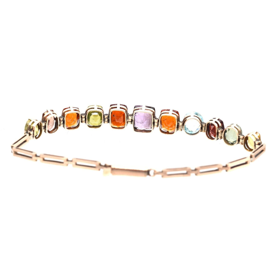 Edwardian 9ct gold harlequin multi-gem bracelet featuring citrine, tourmaline, garnet, aquamarine, and more.