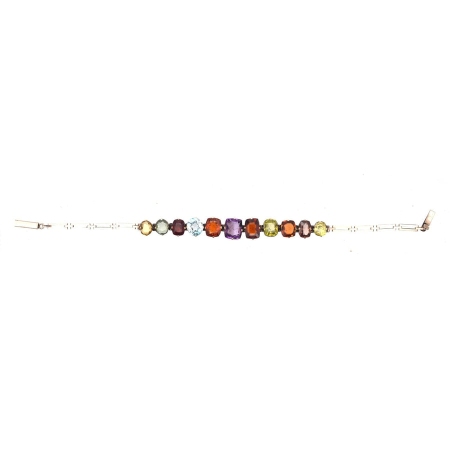 Edwardian 9ct gold harlequin multi-gem bracelet featuring citrine, tourmaline, garnet, aquamarine, smoky quartz, amethyst, peridot.