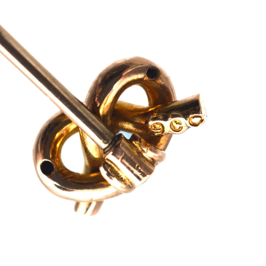 9ct gold lover's knot tie pin featuring an aquamarine, inspired by the Edwardian era design.