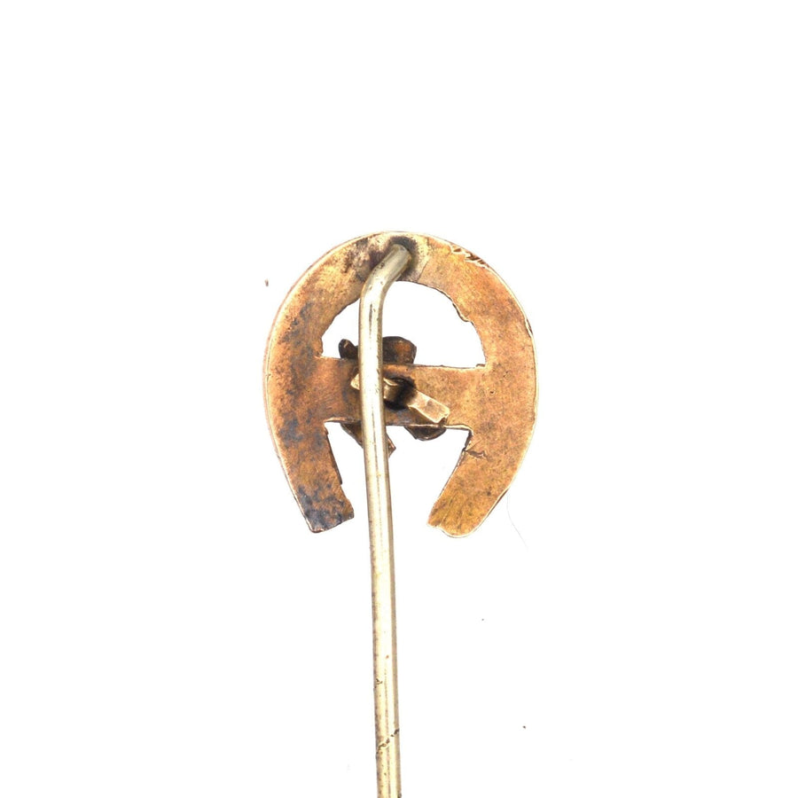 Edwardian 9ct gold lucky horseshoe tie pin featuring Isle of Man Triskelion design, symbolizing good luck.