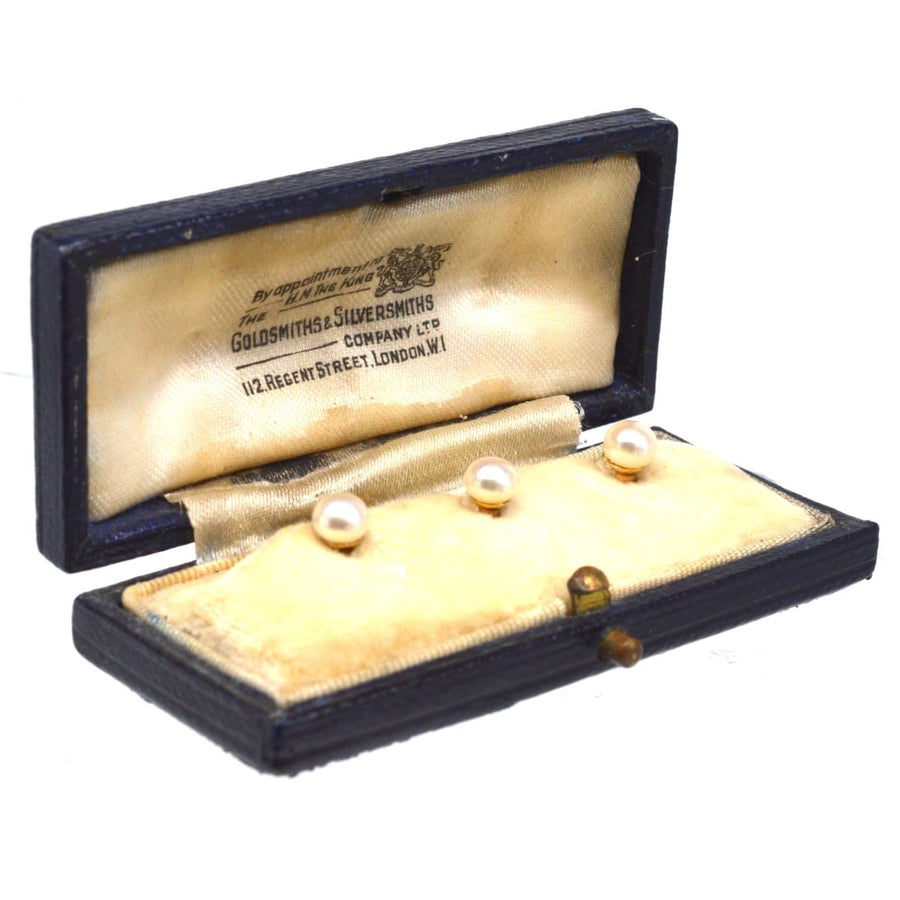 Edwardian 9ct gold natural pearl dress studs in original Goldsmiths & Silversmiths box, showcasing luxurious craftsmanship.