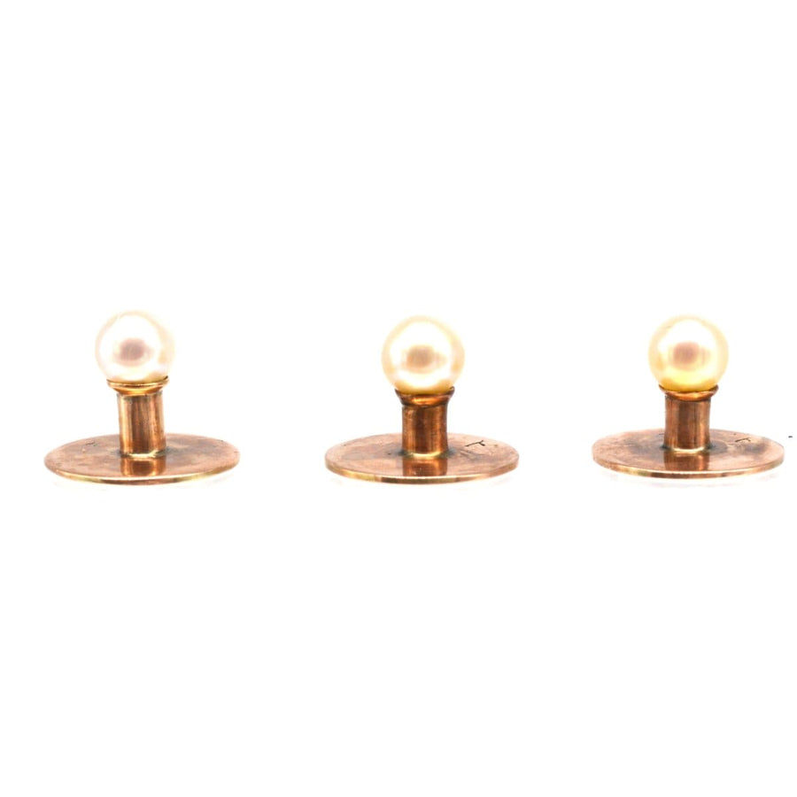 Edwardian 9ct gold natural pearl dress studs trio on gold backings, showcasing their beautiful pearly white sheen.