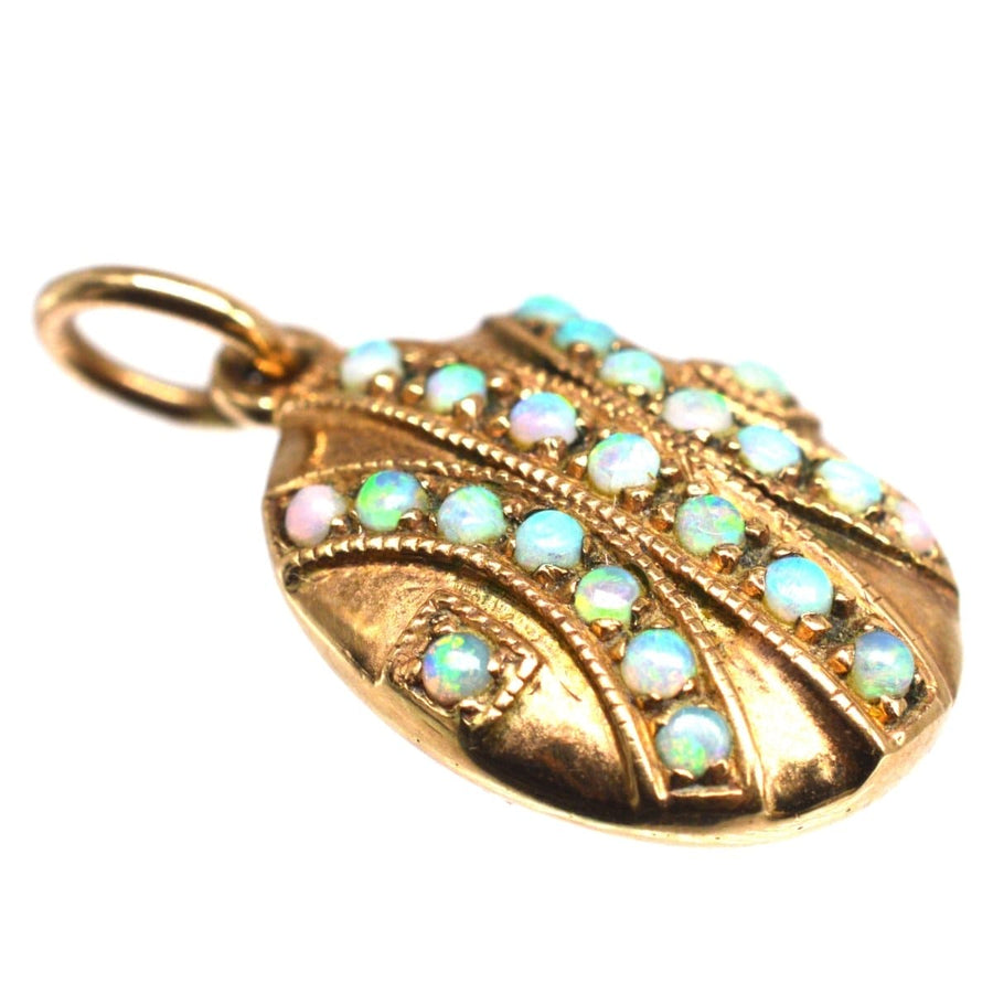 Edwardian 9ct gold oval pendant with 23 vibrant opals in a geometric design, perfect for October birthdays.