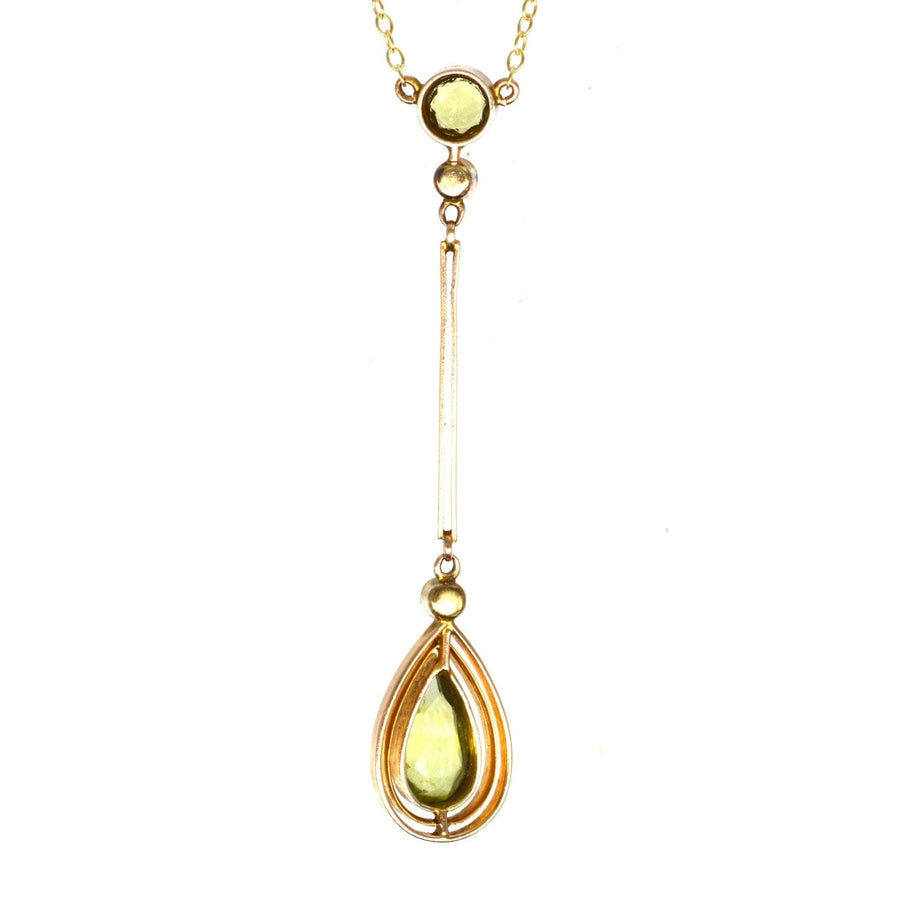 Edwardian 9ct gold pendant featuring peridot and pearl drops, showcasing a stunning olive green design.