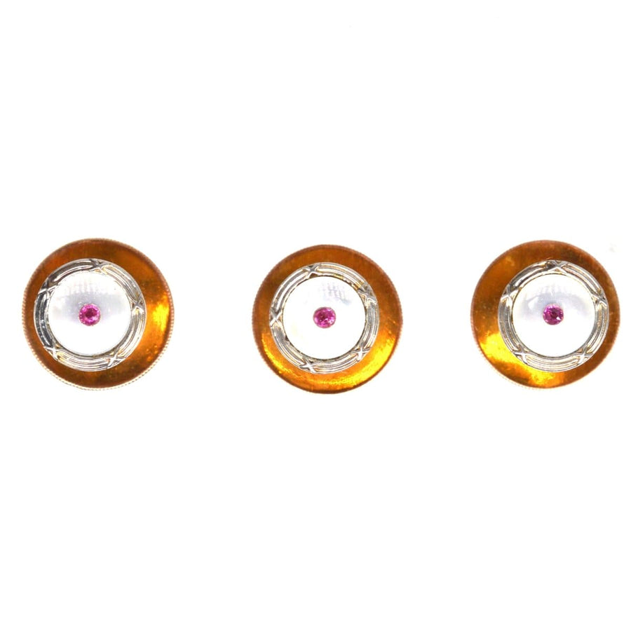 Elegant set of Edwardian 9ct gold and platinum dress studs with mother of pearl and ruby accents.