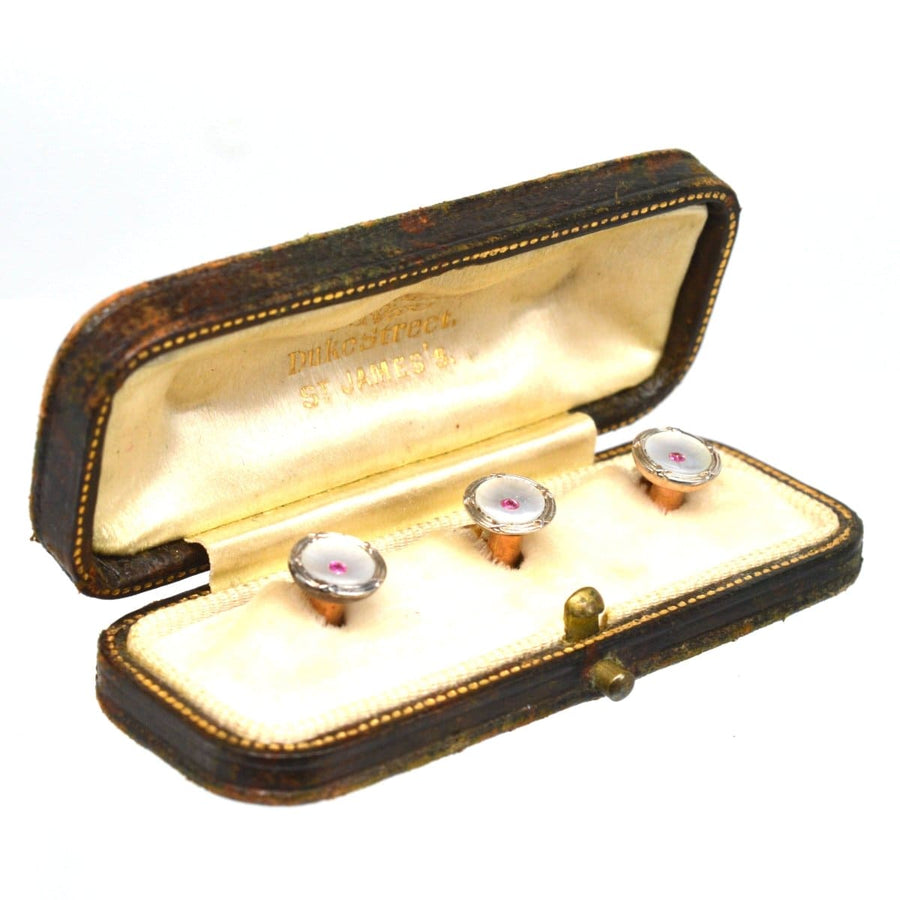 Elegant set of Edwardian 9ct gold and platinum dress studs with mother of pearl and ruby, presented in a vintage box.