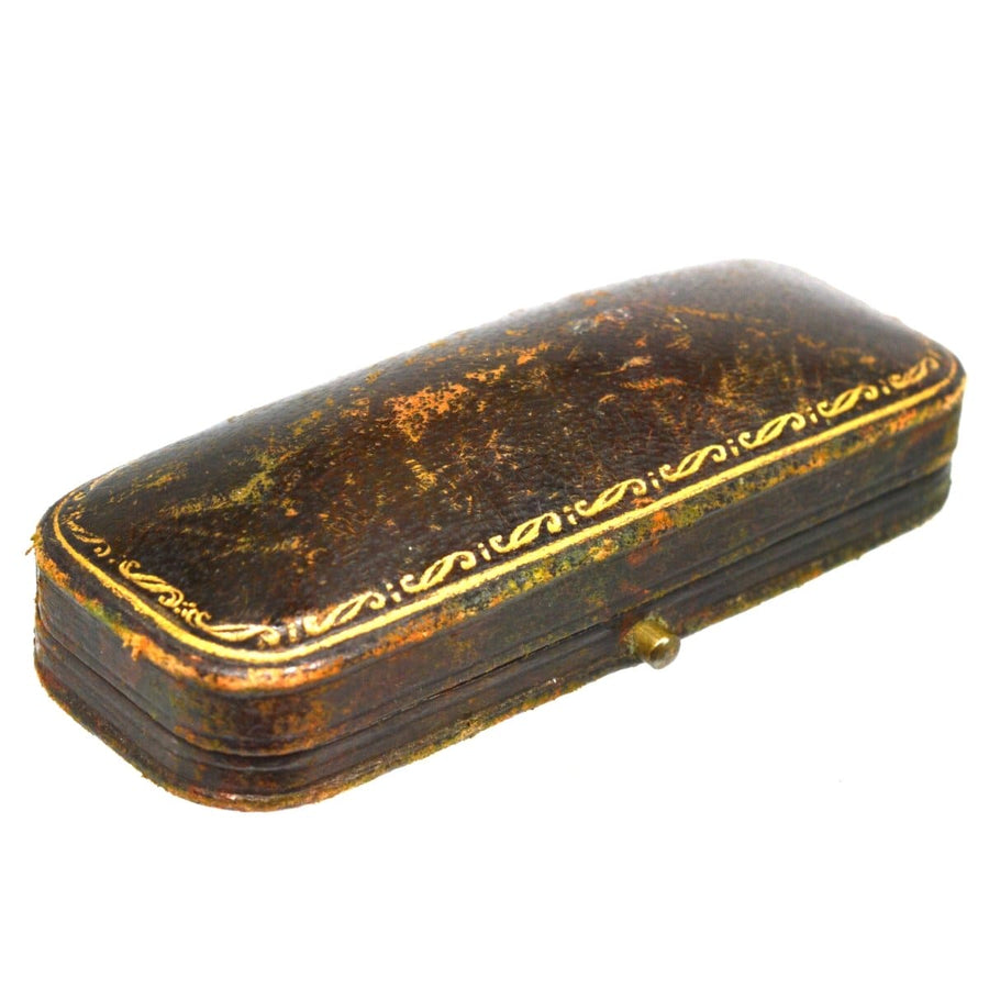 Vintage leather box with decorative gold trim and rounded edges, ideal for storage or display.