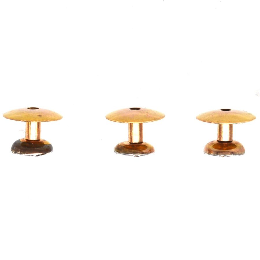 Edwardian 9ct gold and platinum dress studs with mother of pearl and ruby details, set of three.