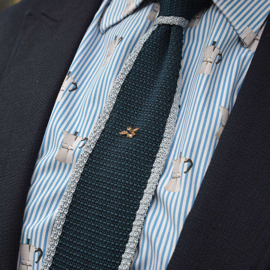 Edwardian 9ct gold bee tie pin with sapphire and pearls on a stylish tie and shirt.
