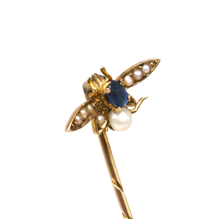 Edwardian 9ct gold bee tie pin featuring sapphire and natural pearl accents, perfect for silk ties or lapels.