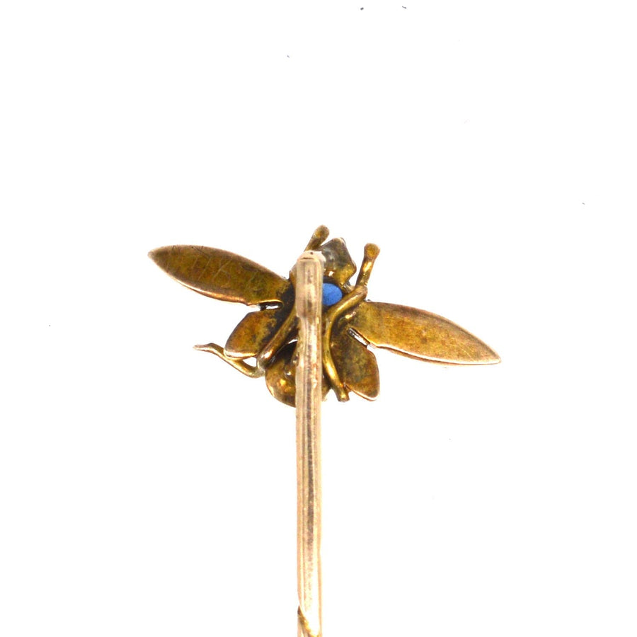 Edwardian 9ct gold bee tie pin with sapphire and pearl details, perfect accessory for silk ties or lapels.