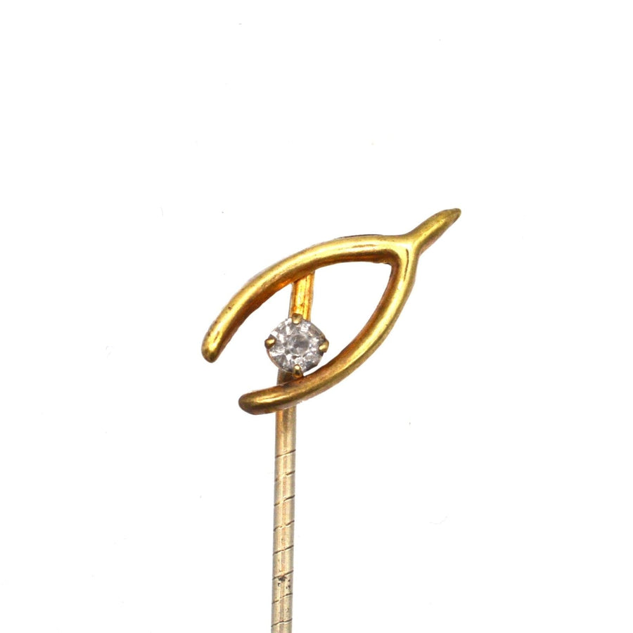 Edwardian 9ct gold wishbone tie pin with white paste, a symbol of love and good luck.