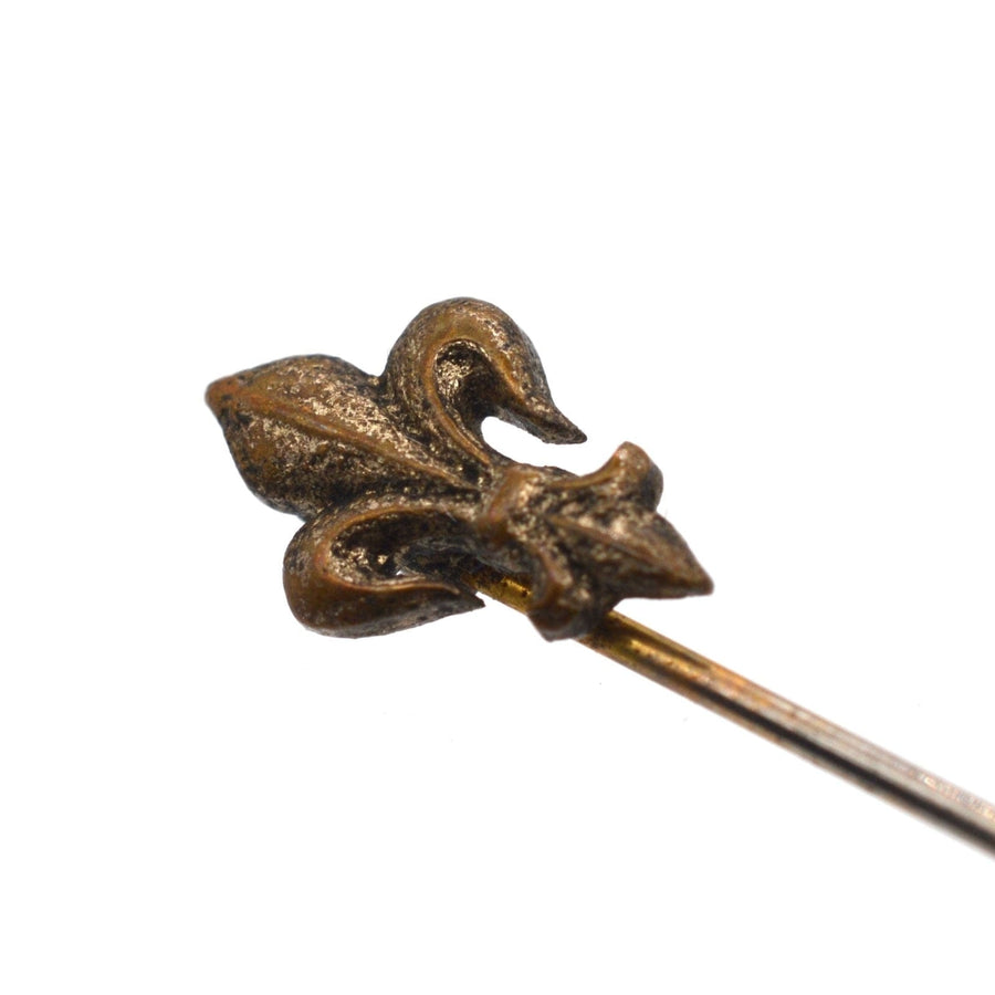 Edwardian French Fleur-de-lys tie pin in bronze, featuring intricate details and a classic design.