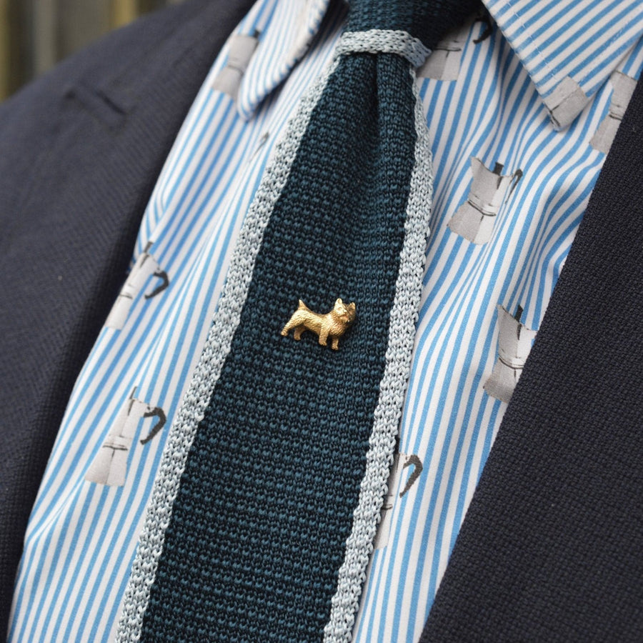 Edwardian 9ct gold Cairn Terrier dog tie pin on a stylish silk tie, showcasing elegant design and sentimental value.