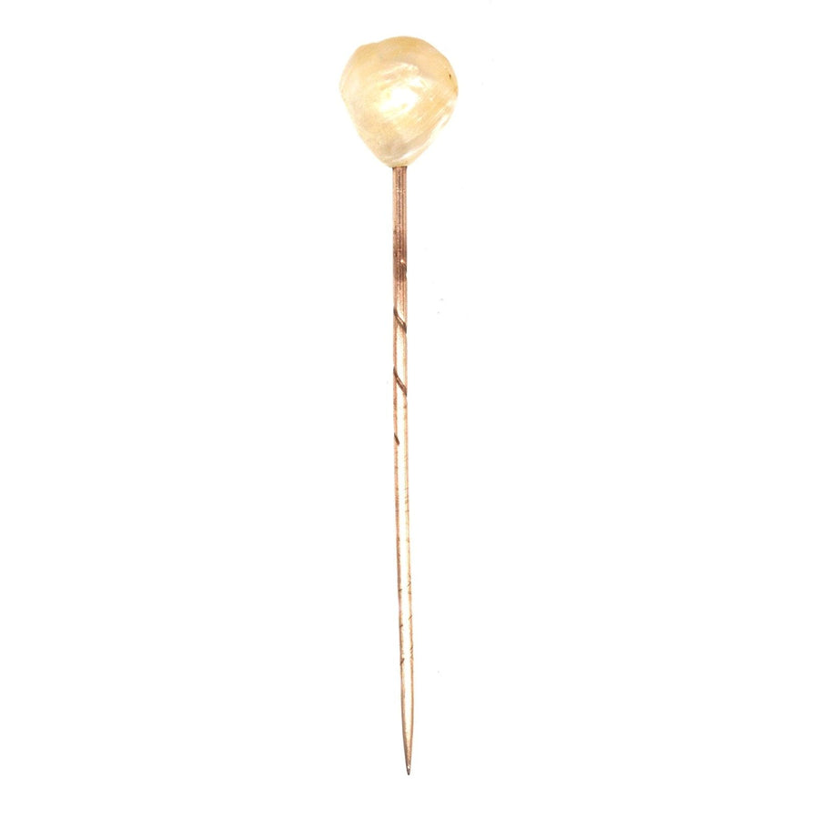 Edwardian large natural baroque pearl tie pin on silk tie, symbolizing love and integrity, stylish groom's accessory.