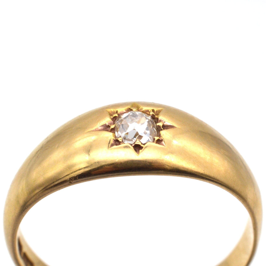 Edwardian 18ct gold gypsy ring featuring a 0.18 carat old mine cut diamond in a star setting.