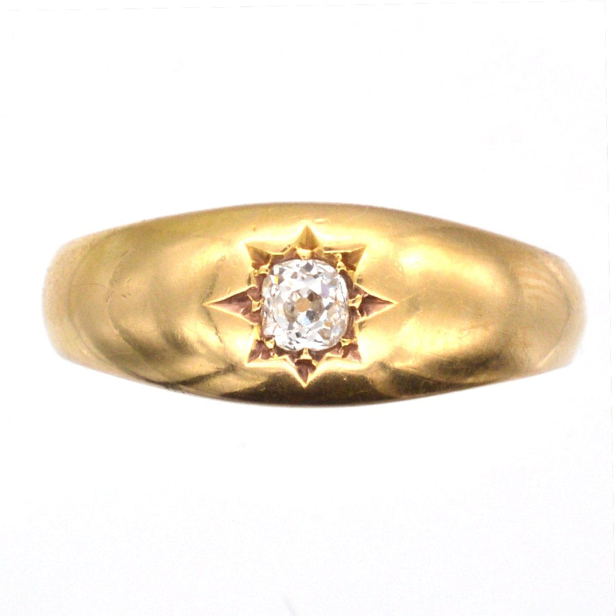 Edwardian 18ct gold gypsy ring featuring a 0.18 carat old mine cut diamond in a star setting.