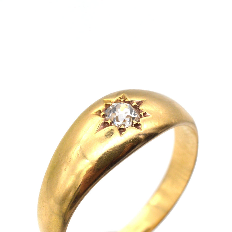 Edwardian 18ct gold gypsy ring featuring a 0.18 carat old mine cut diamond in a star setting.