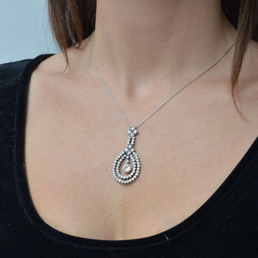 Edwardian platinum pendant featuring a 1.3 carat diamond, suspended on an 18ct white gold chain.