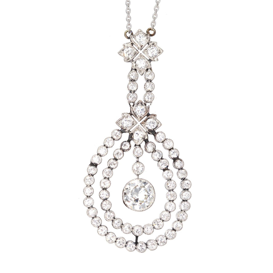 Edwardian platinum pendant featuring 1.3 carat diamond and smaller diamonds on a white gold chain.