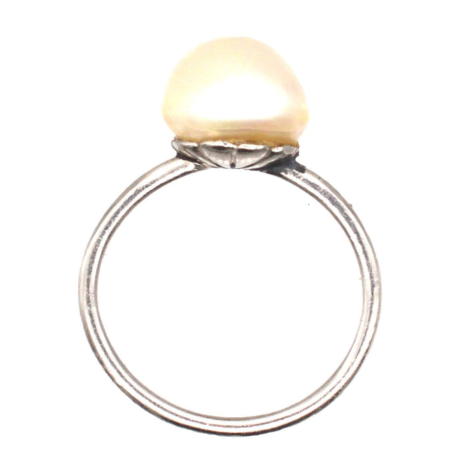 Edwardian platinum solitaire ring featuring a certified natural saltwater pearl, circa 1910s.