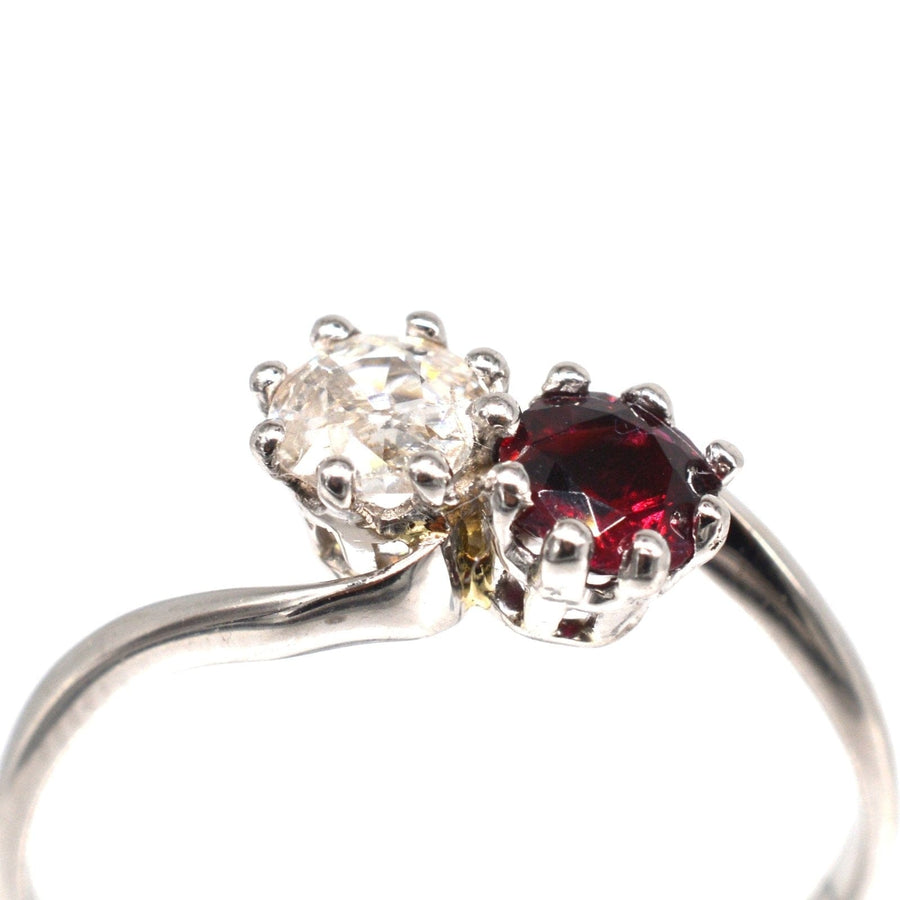 Edwardian crossover ring featuring a ruby and old mine cut diamond for a romantic 'Toi et Moi' design.