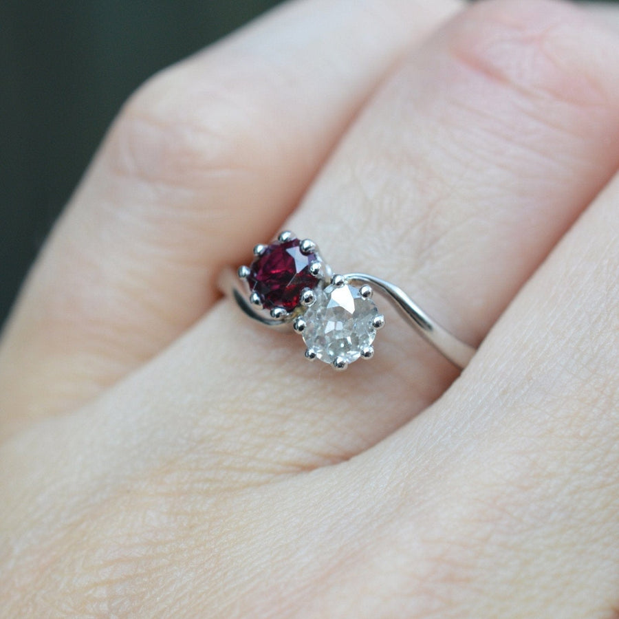 Edwardian crossover ring featuring a ruby and old mine cut diamond, symbolizing love and connection.