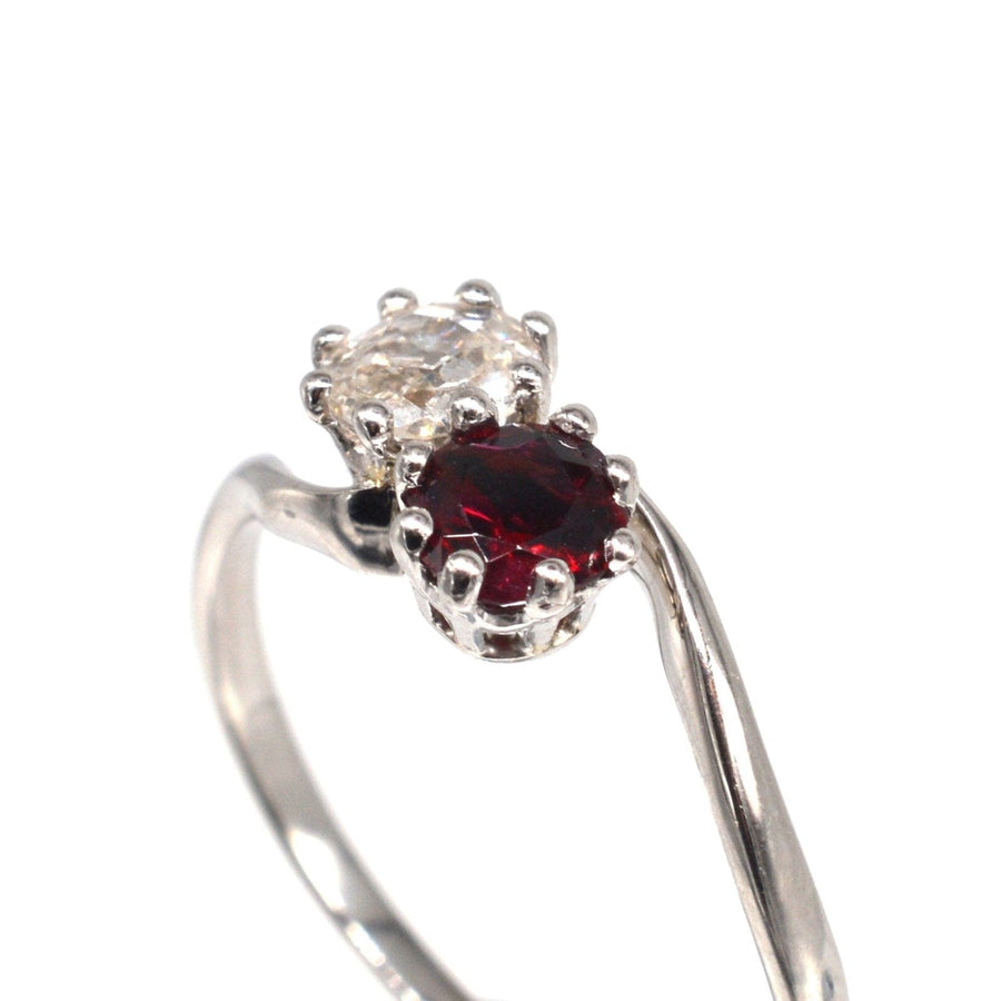 Edwardian crossover ring featuring a ruby and old mine cut diamond, symbolizing love and romance.