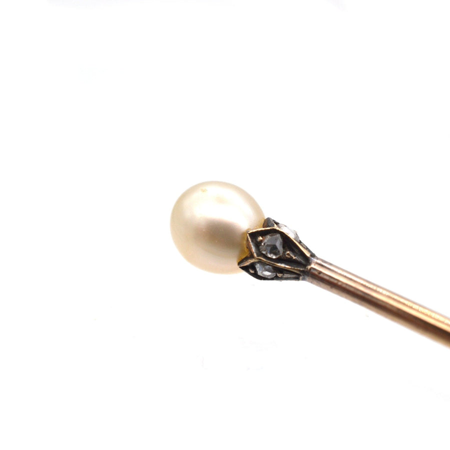 Edwardian silver tie pin featuring a natural pearl and diamond-studded petals, perfect for silk ties.