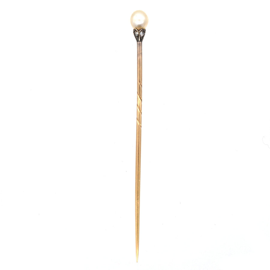 Edwardian silver and gold tie pin featuring a natural pearl and diamond petals, perfect for a colorful silk tie.