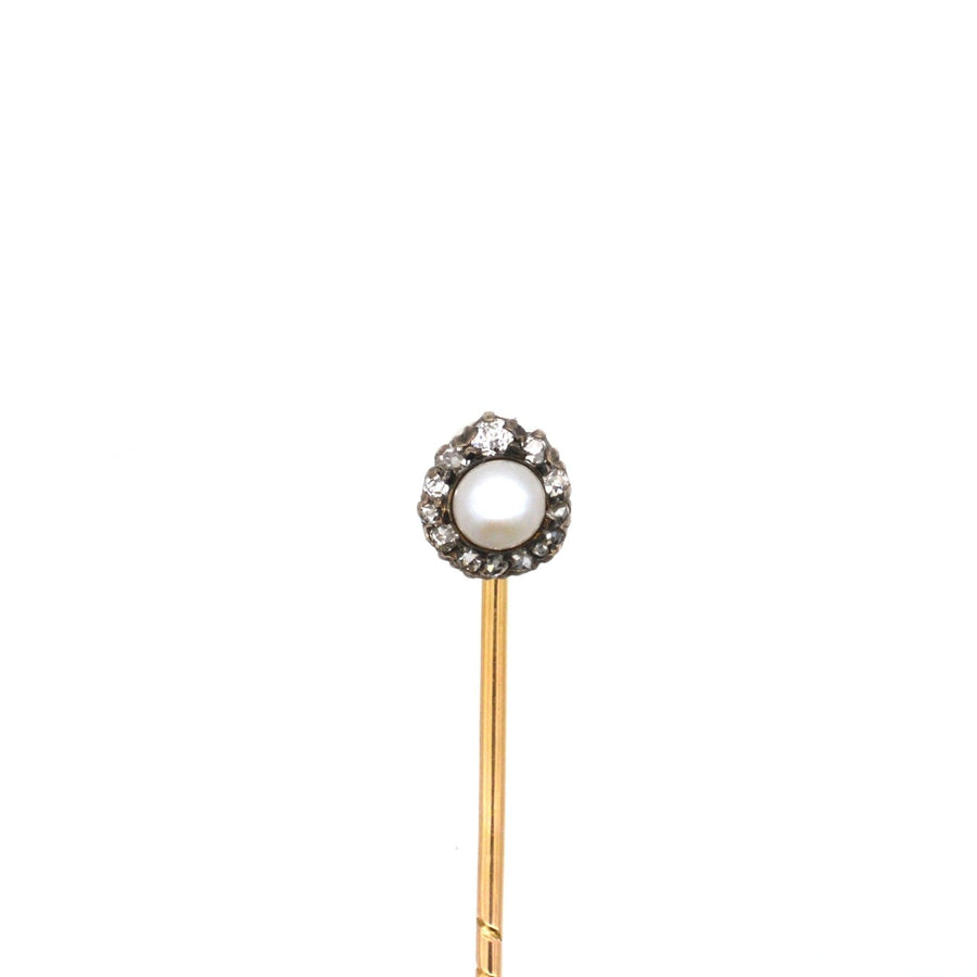 Edwardian silver and gold tie pin featuring a pearl and old mine cut diamond cluster, circa 1890s-1900s.