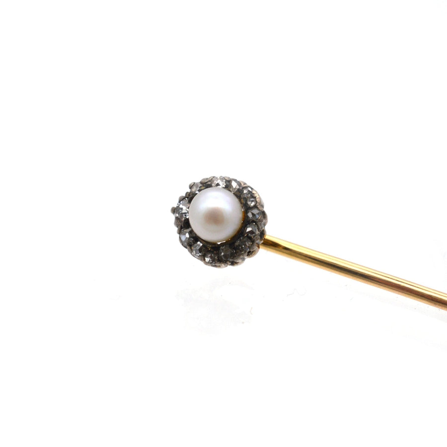 Edwardian tie pin with natural pearl and diamond cluster, showcasing vintage craftsmanship.