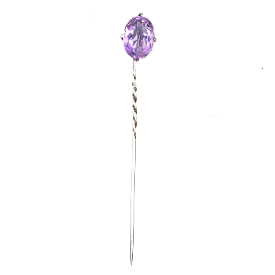 Edwardian silver tie pin featuring an oval natural amethyst, elegant design with twist detail.