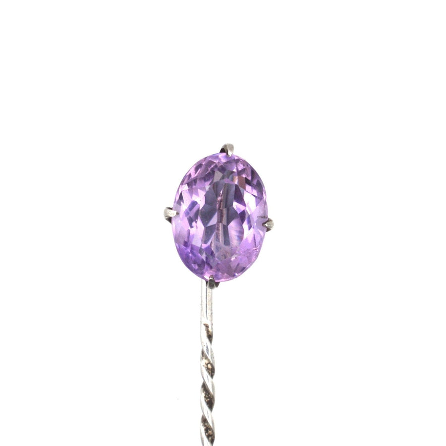 Edwardian silver tie pin featuring a stunning oval amethyst gemstone, showcasing its exquisite craftsmanship.