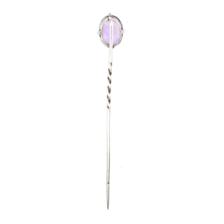 Edwardian silver tie pin featuring a natural amethyst stone in an elegant design.