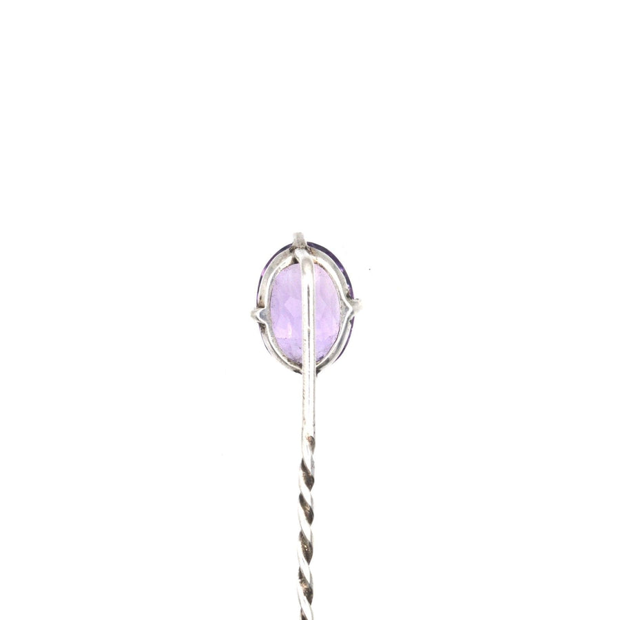 Edwardian silver tie pin featuring a natural amethyst stone, showcasing vintage elegance and charm.