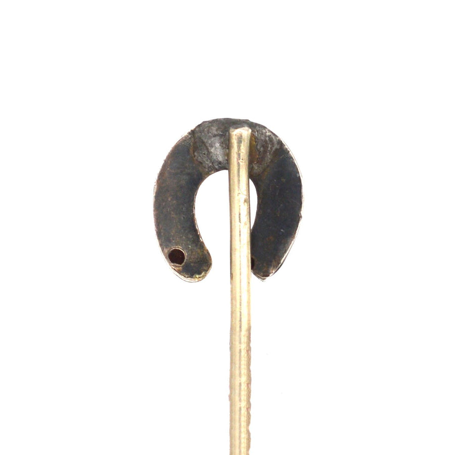 Antique Edwardian silver lucky horseshoe tie pin from the 1900s, symbolizing good luck and protection.