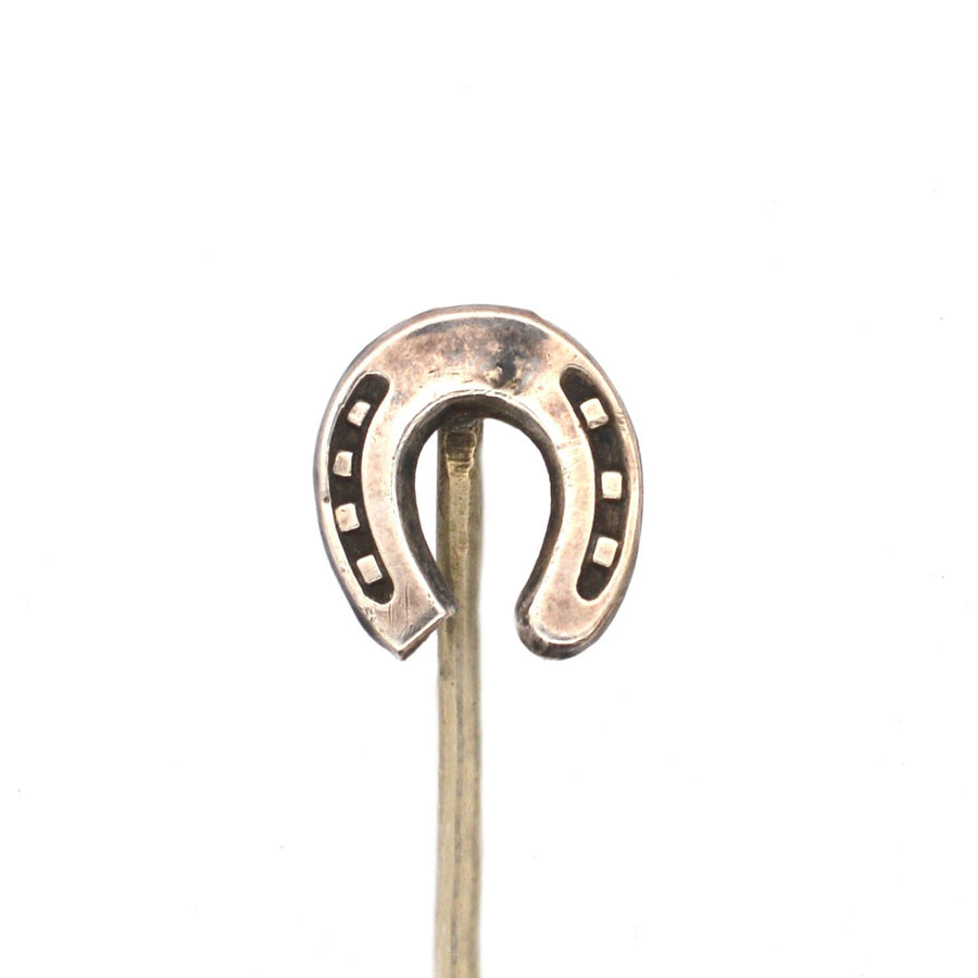 Edwardian silver horseshoe tie pin symbolizing good luck and protection from evil, crafted in the 1900s.