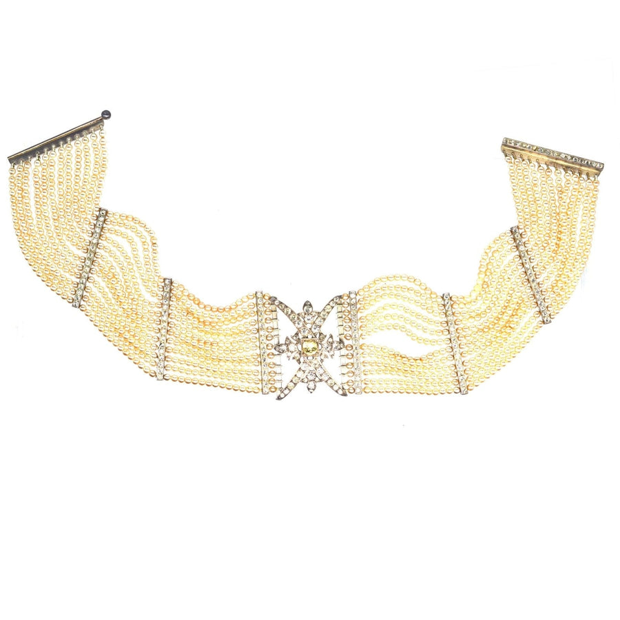 Edwardian silver, paste and pearl choker featuring layered strands and decorative center detail.