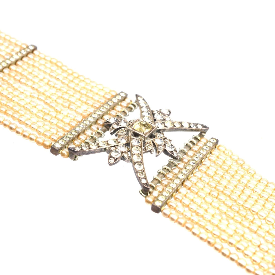 Edwardian silver choker with pearls and decorative star-shaped clasp, reminiscent of Queen Alexandra's style.