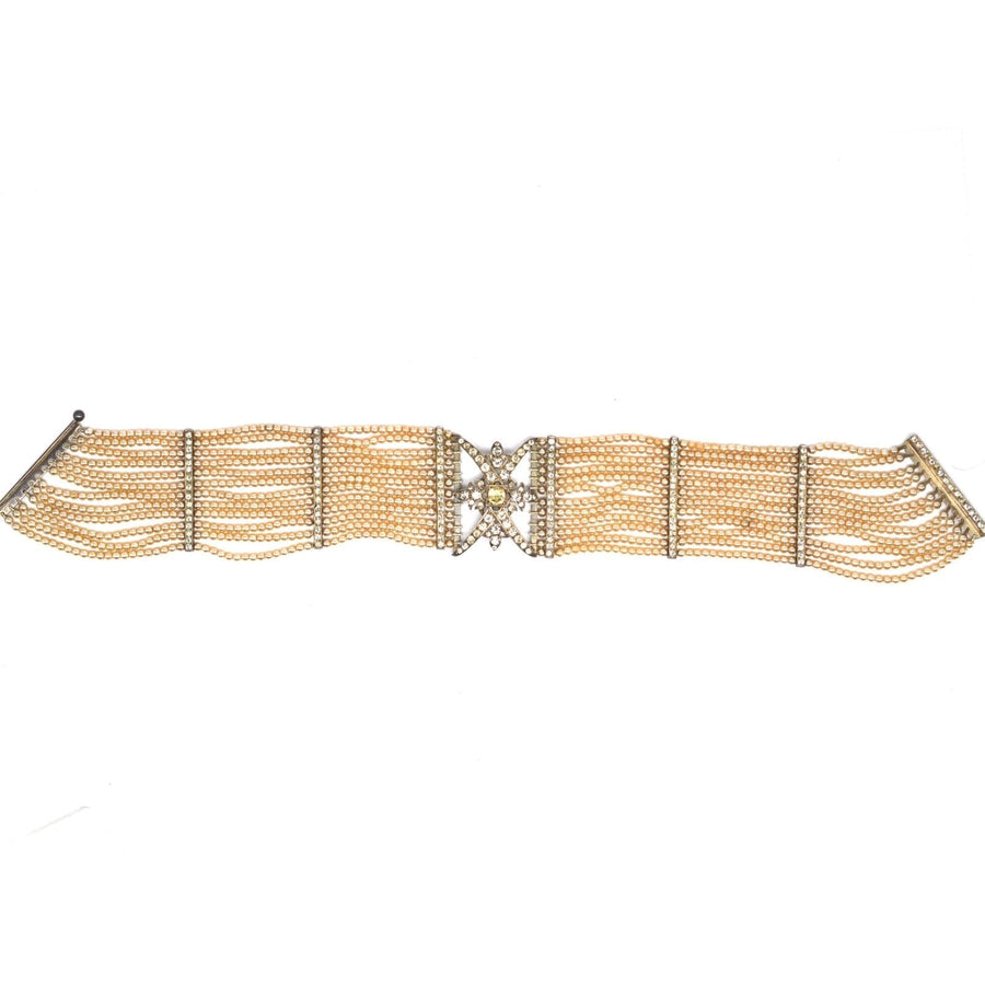 Edwardian silver choker featuring pearls and diamond accents, showcasing intricate design and elegance.