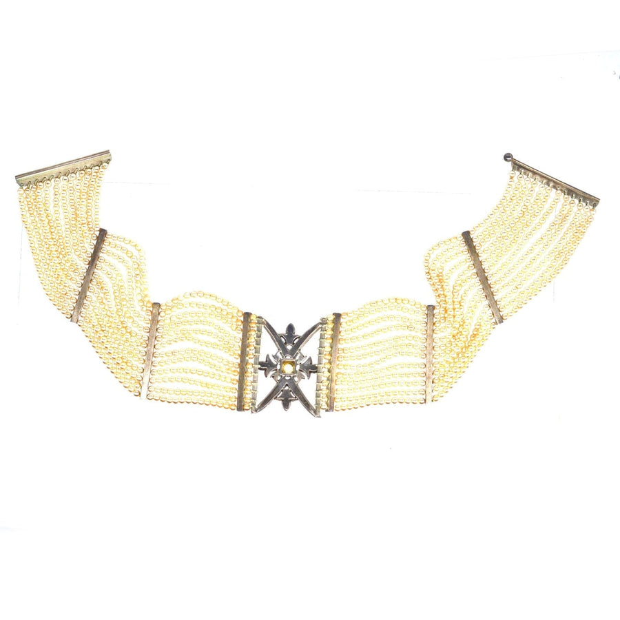 Edwardian silver choker featuring pearls and an ornate diamond-like centerpiece, perfect for elegant occasions.