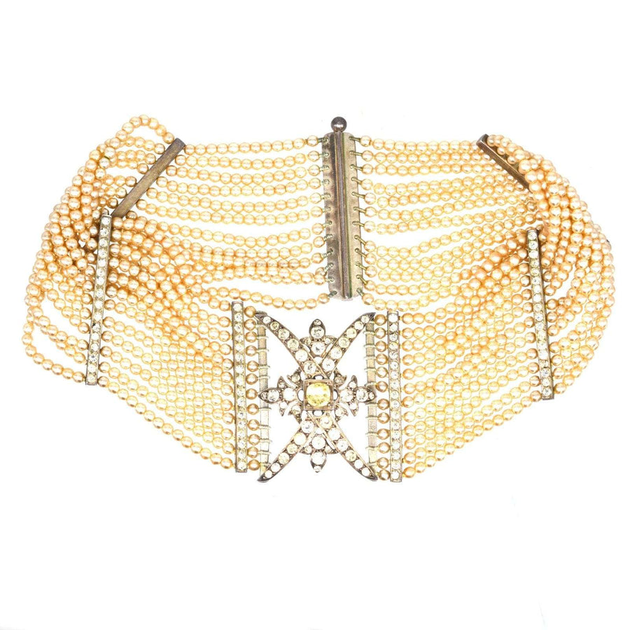 Edwardian silver choker with paste and pearls, featuring intricate design and multiple strands.