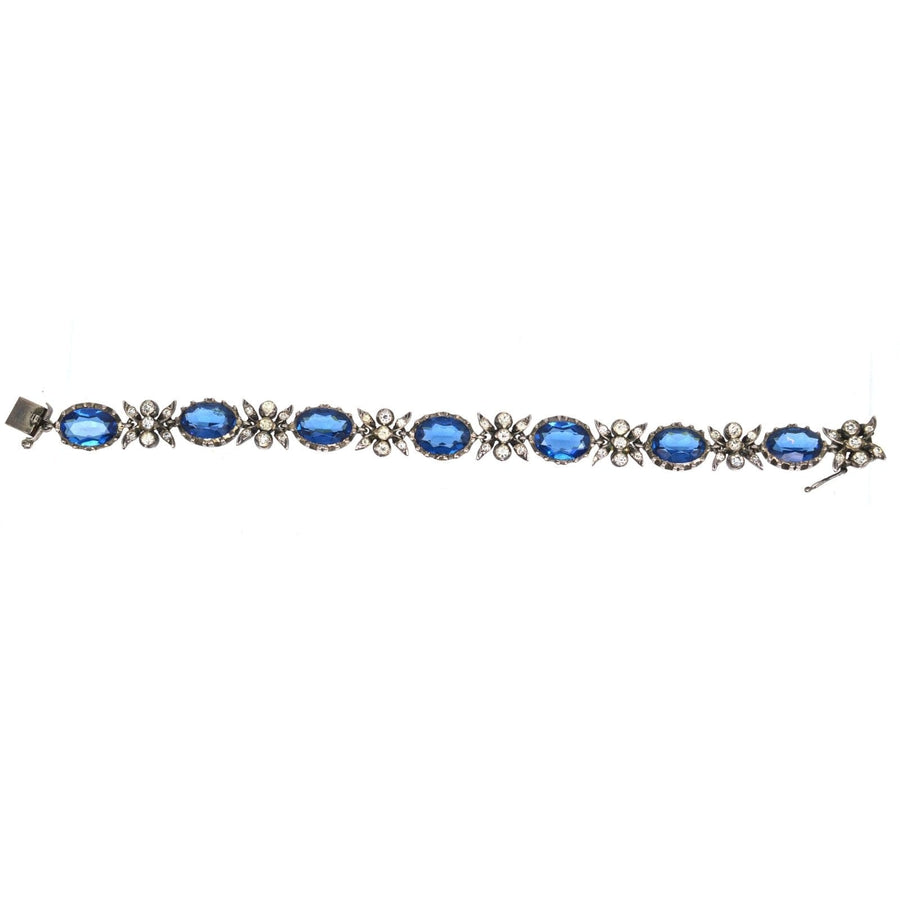 Elegant Edwardian silver bracelet featuring sapphire blue and white paste stones, ideal for a stunning accessory set.