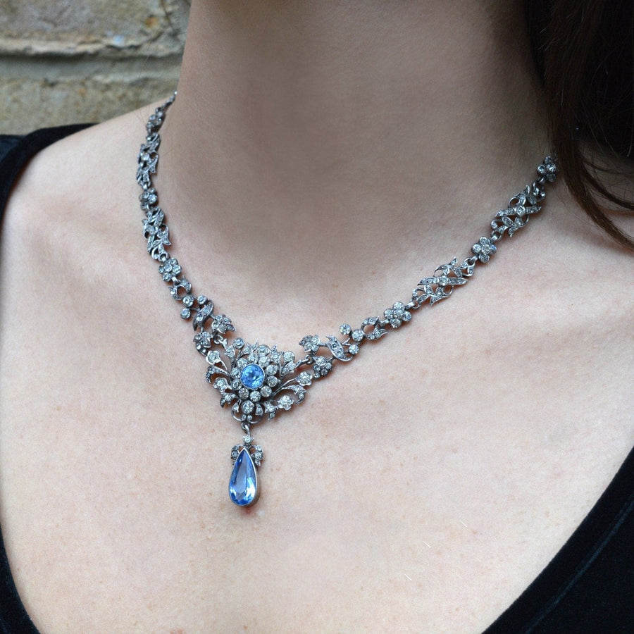 Edwardian silver necklace featuring aquamarine paste and diamond cluster, perfect for weddings or elegant parties.