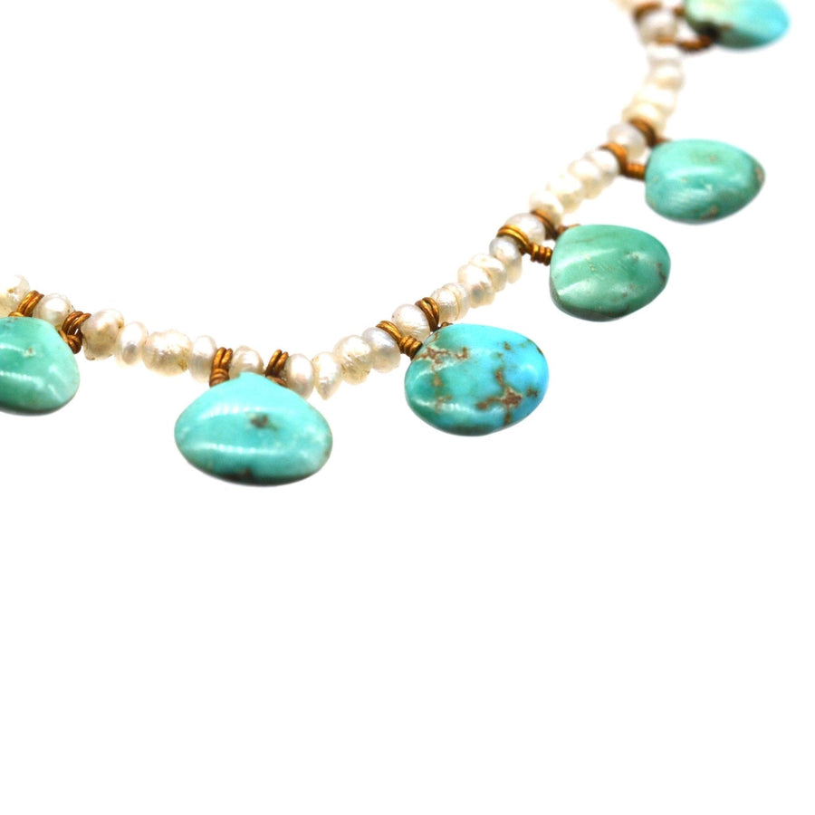 Edwardian turquoise and seed pearl necklace showcasing scallop-shaped turquoise stones and elegant pearls.
