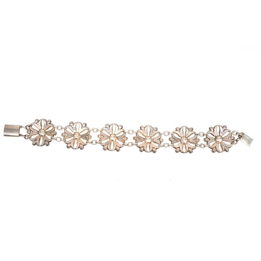 Edwardian white and purple floral cluster bracelet featuring diamond and amethyst paste stones in an elegant design.